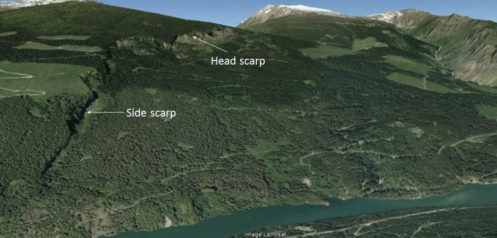 Figure 15.9 The Downie Slide, a sackung, on the shore of the Revelstoke Reservoir (above the Revelstoke Dam). The head scarp is visible at the top and a side-scarp along the left side. [from Google Earth]