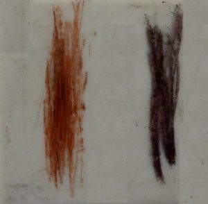 Figure 2.17 The streak colours of earthy hematite (left) and specular hematite (right). Although the specular hematite streak looks close to black, it does have red undertones that you can see if you look closely. [SE]