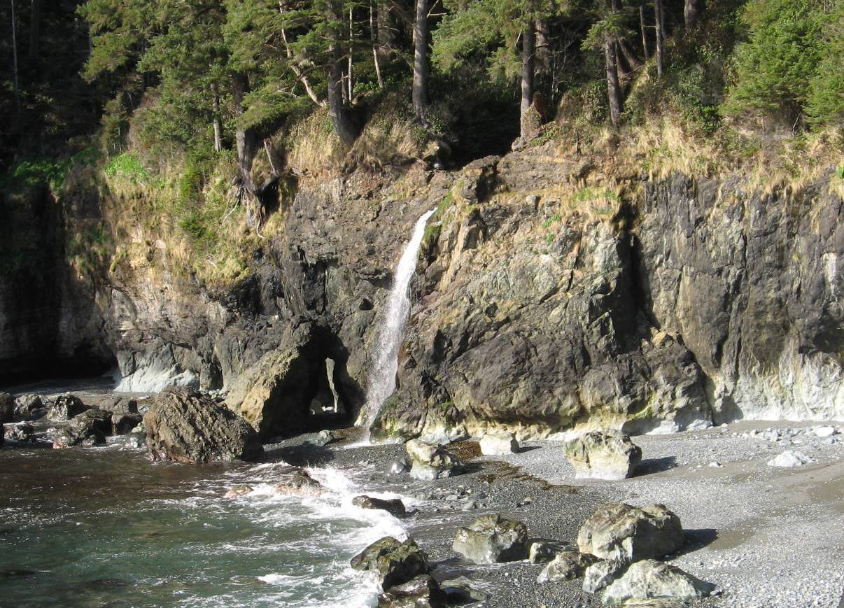 Figure 17.26 This stream is on the southwest coast of Vancouver Island near Sooke. Like many other streams along this coast, it used to flow directly into the ocean, but the land has been uplifted by post-glacial isostatic rebound. [SE]